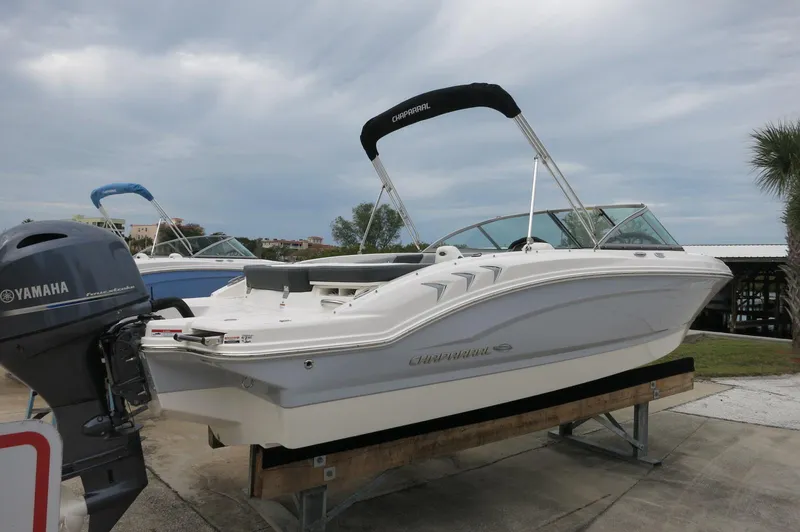 Slide: The Image of 2024 Chaparral 19 SSi boat on display with Yamaha outboard motor. - 3