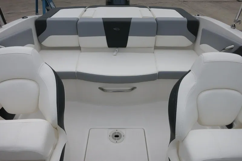 Slide: The Image of 2024 Chaparral 19 SSi boat interior with white and gray seating. - 30