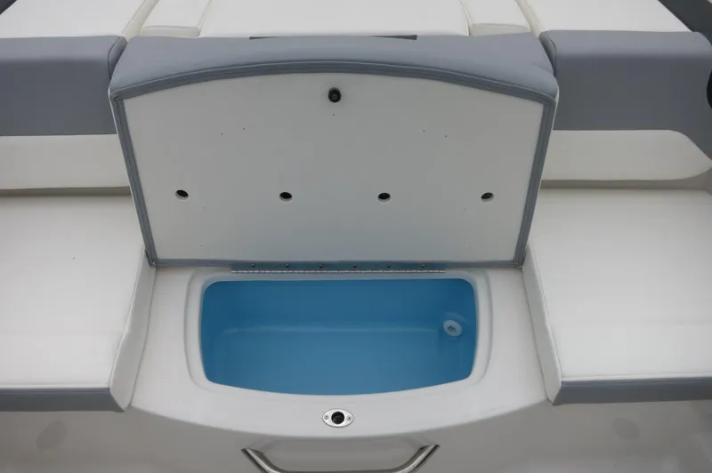 Slide: The Image of 2024 Chaparral 19 SSi boat with open storage compartment. - 31