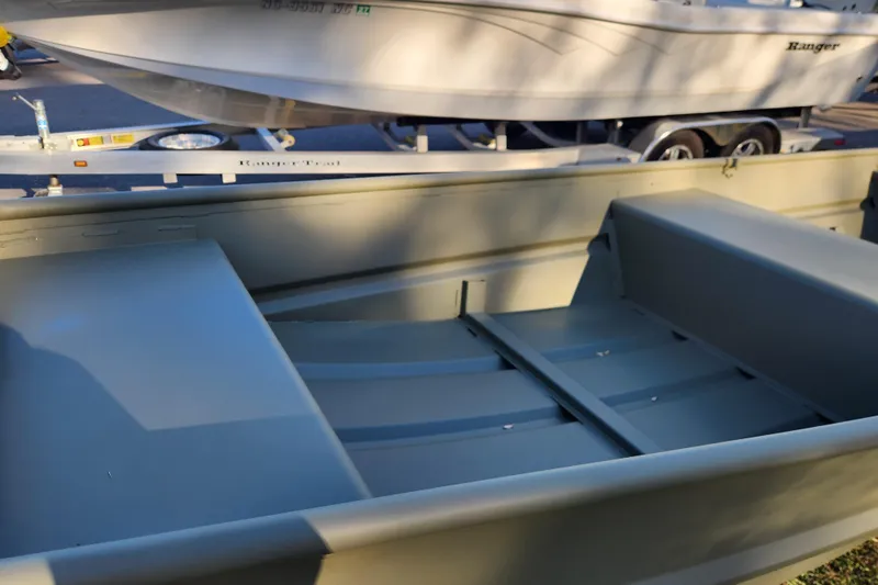 Slide: The Image of 2026 Tracker Grizzly 1436 Utility boat interior, showcasing seating and storage. - 5