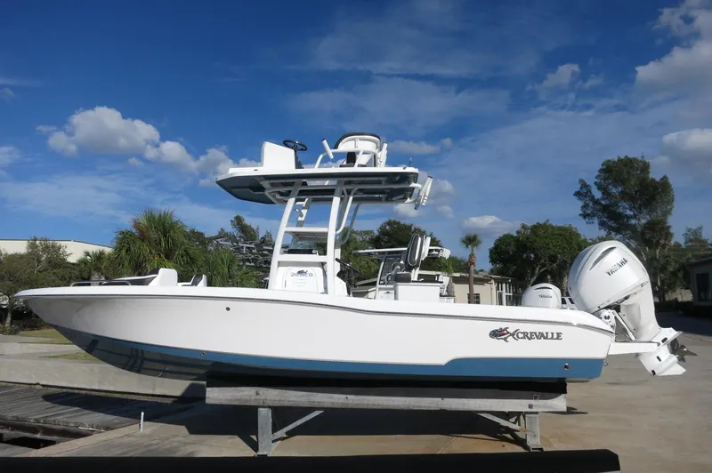 The Image of 2024 Crevalle 26 HCO boat on a trailer under a blue sky. - 1