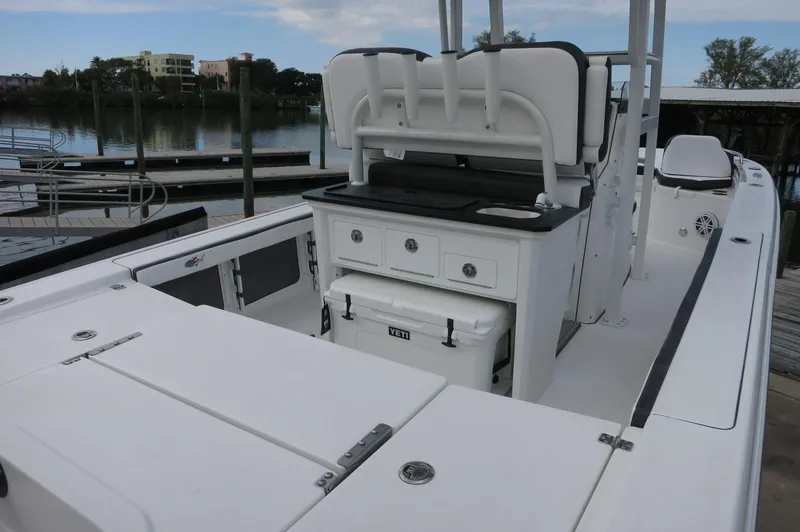 Slide: The Image of 2024 Crevalle 26 HCO boat interior with seating and storage compartments. - 14