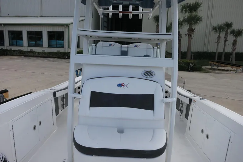 Slide: The Image of 2024 Crevalle 26 HCO boat interior with seating and storage compartments. - 18