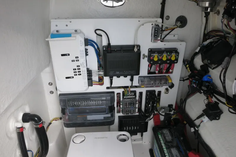 Slide: The Image of 2024 Crevalle 26 HCO boat electrical system and battery compartment. - 20