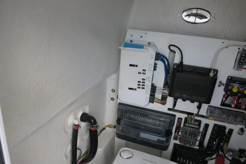 Slide: The Image of Electrical panel and wiring inside a 2024 Crevalle 26 HCO boat. - 22