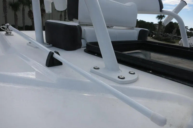 Slide: The Image of 2024 Crevalle 26 HCO boat deck with seating and rod holder. - 28