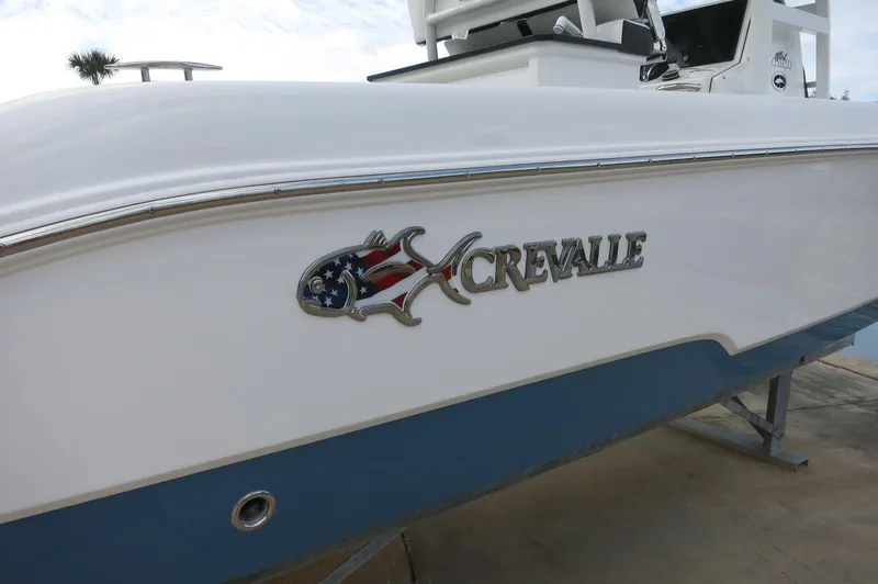 Slide: The Image of 2024 Crevalle 26 HCO boat side view with logo. - 5