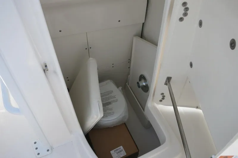 Slide: The Image of 2024 Robalo R266 Skydeck storage compartment with cushions and box. - 11