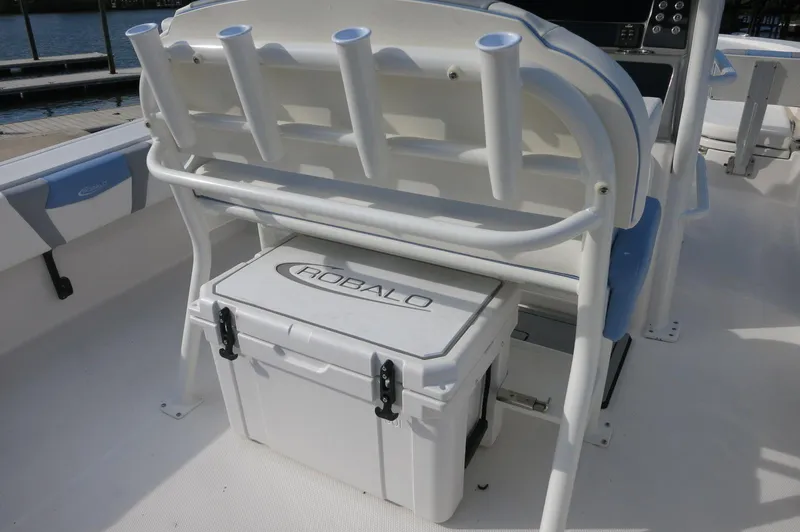 Slide: The Image of 2024 Robalo R266 Skydeck boat with integrated cooler and rod holders. - 20