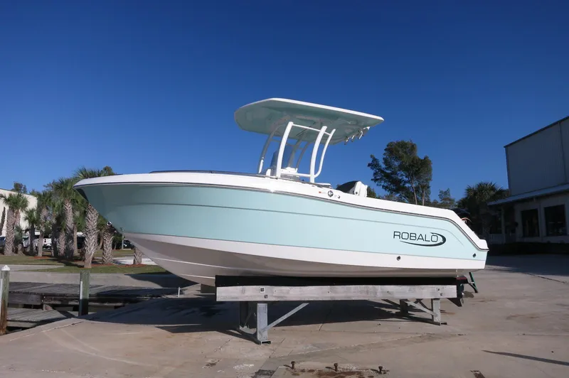 The Image of 2024 Robalo 222 Explorer CC boat on a stand, side view. - 0