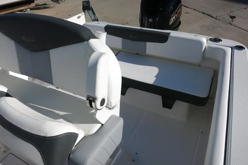 Slide: The Image of 2024 Robalo 222 Explorer CC boat interior seating area. - 21