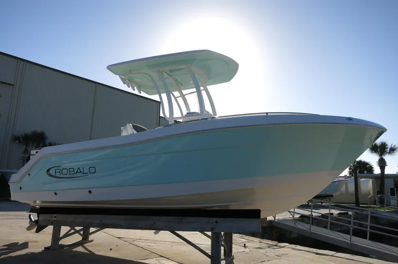 Slide: The Image of 2024 Robalo 222 Explorer CC boat on display outdoors. - 3