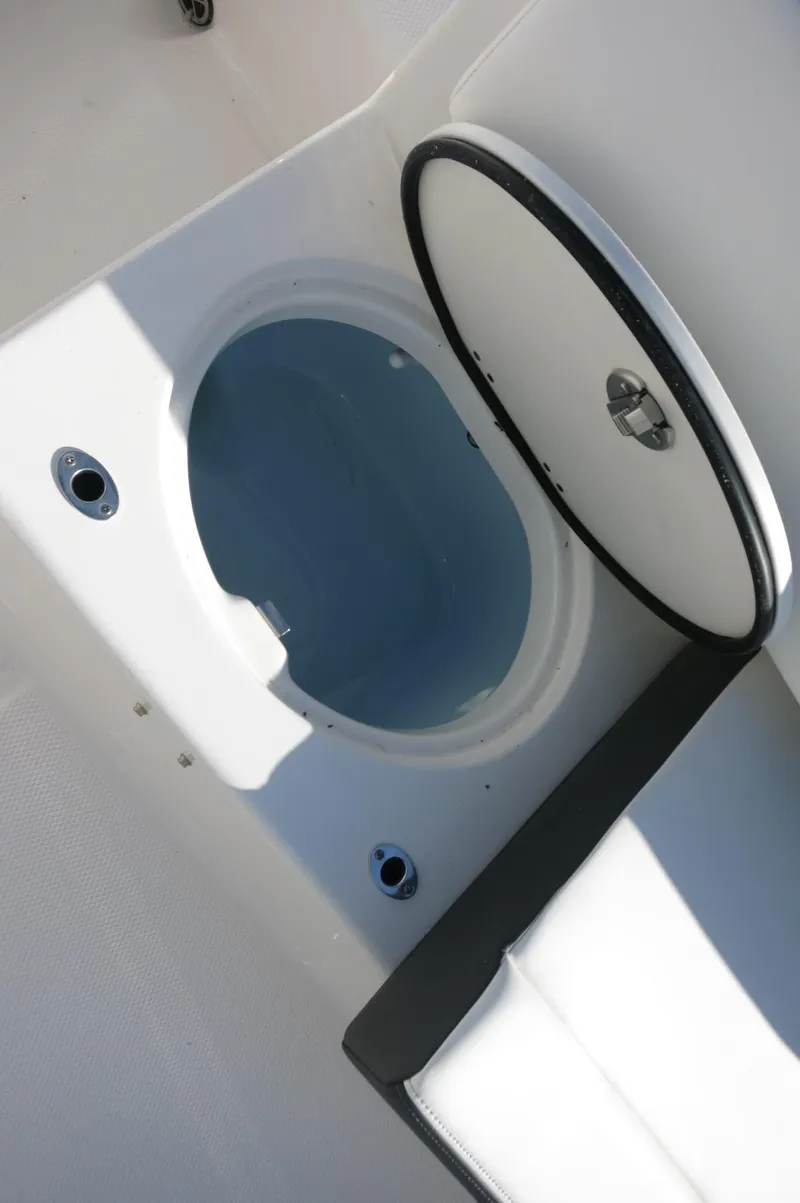 Slide: The Image of Livewell compartment on the 2024 Robalo 222 Explorer CC boat. - 31