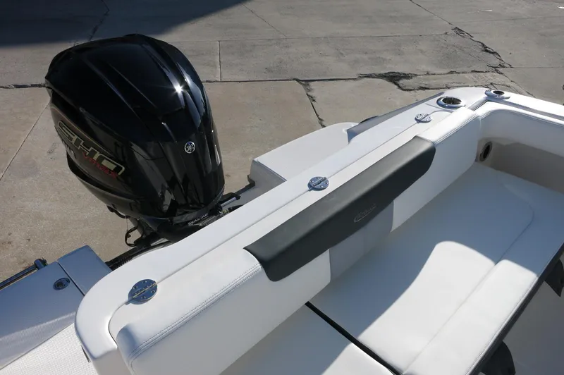 Slide: The Image of 2024 Robalo 222 Explorer CC boat with Yamaha outboard motor and white seating. - 42