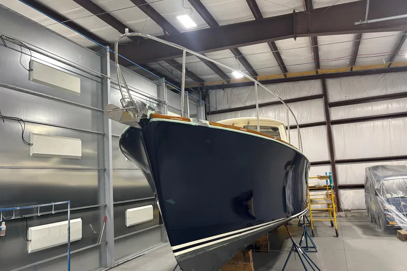 Slide: The Image of 2003 Hinckley 36 Picnic Boat EP in a storage facility, showcasing its sleek design. - 3