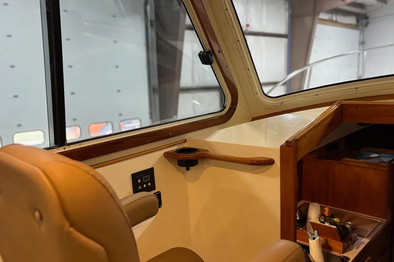 Slide: The Image of Interior of 2003 Hinckley 36 Picnic Boat EP with leather seating and wooden accents. - 7