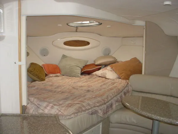 Slide: The Image of Interior cabin of 1998 Maxum 3000SCR boat with cozy bed and pillows. - 7