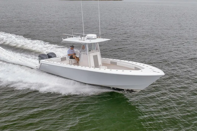 The Image of 2012 Contender 32 Tournament boat cruising on open water. - 0