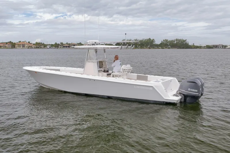 Slide: The Image of 2012 Contender 32 Tournament boat on calm water with Yamaha engine. - 10
