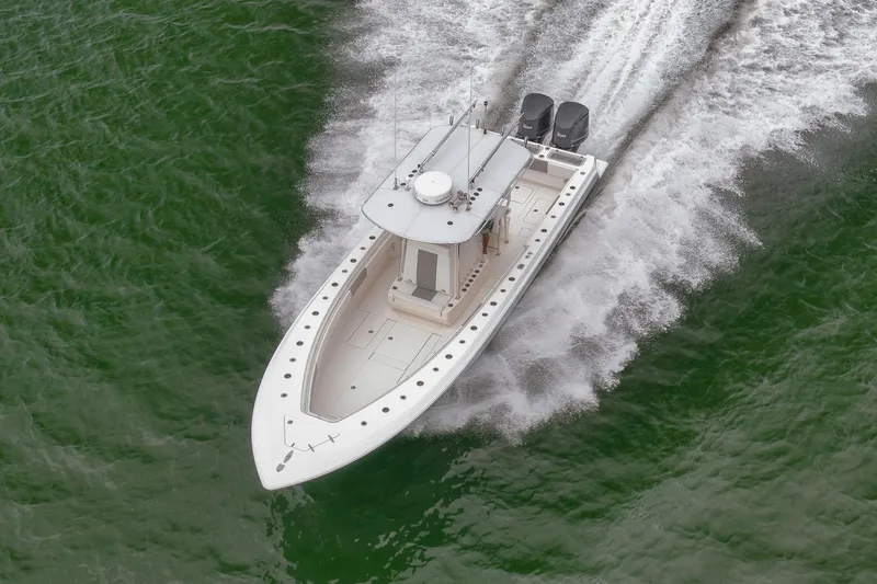 Slide: The Image of 2012 Contender 32 Tournament boat speeding on green water, aerial view. - 18