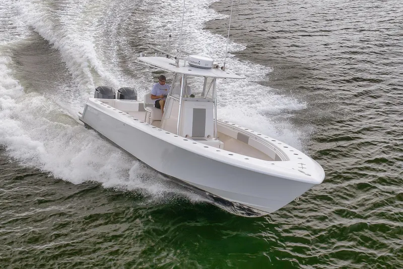 Slide: The Image of 2012 Contender 32 Tournament boat cruising on water, showcasing sleek design and powerful performance. - 30