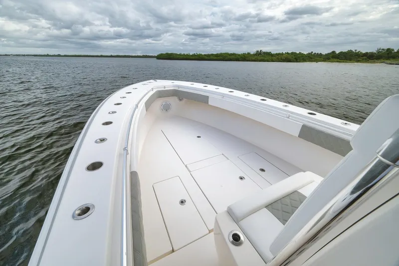 Slide: The Image of 2012 Contender 32 Tournament boat on calm waters under cloudy skies. - 31