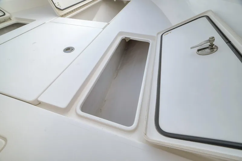 Slide: The Image of 2012 Contender 32 Tournament boat storage compartments with open hatches. - 35
