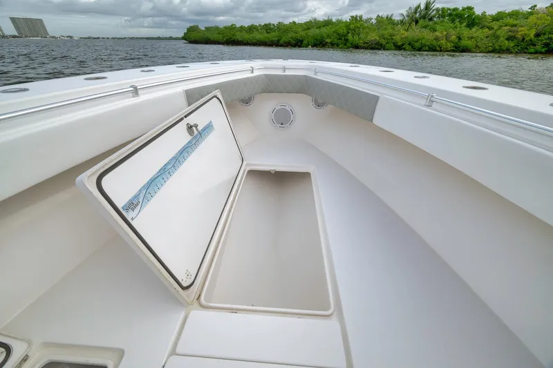 Slide: The Image of 2012 Contender 32 Tournament boat with open storage compartment on deck. - 36