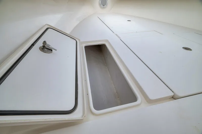 Slide: The Image of 2012 Contender 32 Tournament boat storage compartment with open hatch. - 38