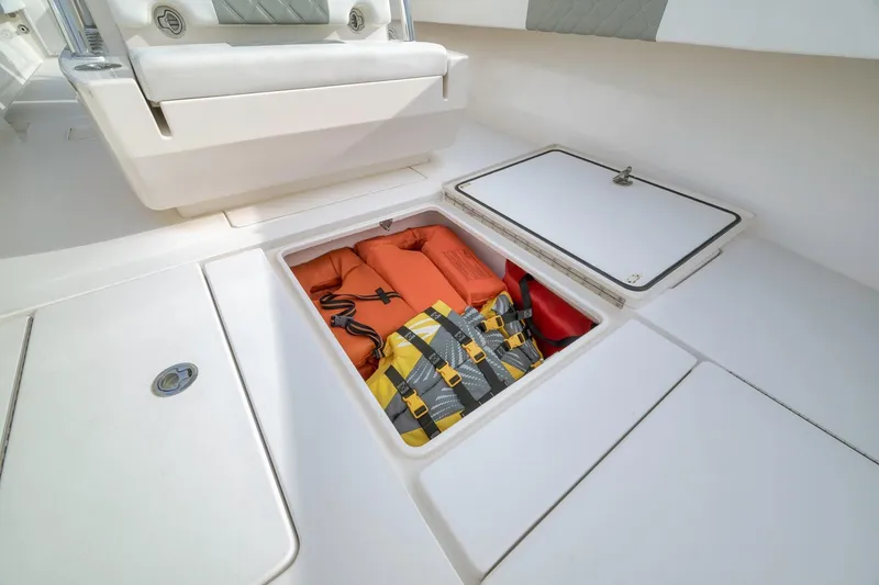 Slide: The Image of 2012 Contender 32 Tournament boat storage with life jackets and safety gear. - 40