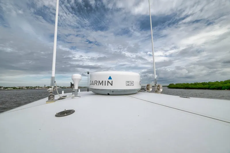 Slide: The Image of 2012 Contender 32 Tournament boat with Garmin radar, under cloudy sky. - 41