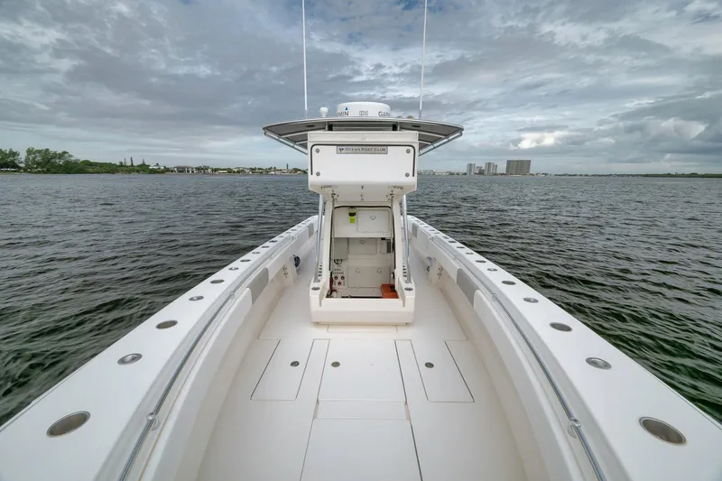 Slide: The Image of 2012 Contender 32 Tournament boat on open water under cloudy sky. - 42