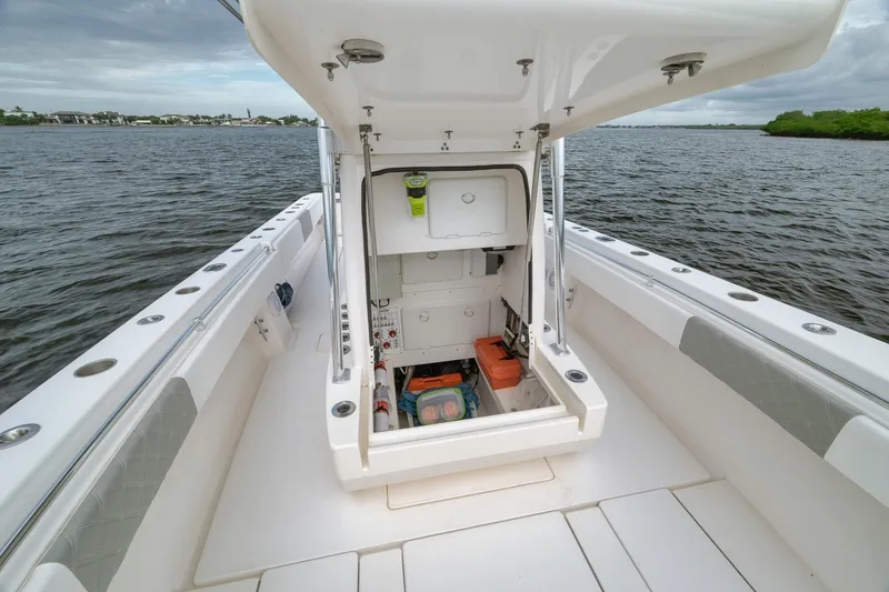 Slide: The Image of 2012 Contender 32 Tournament boat with open storage compartment on deck. - 44