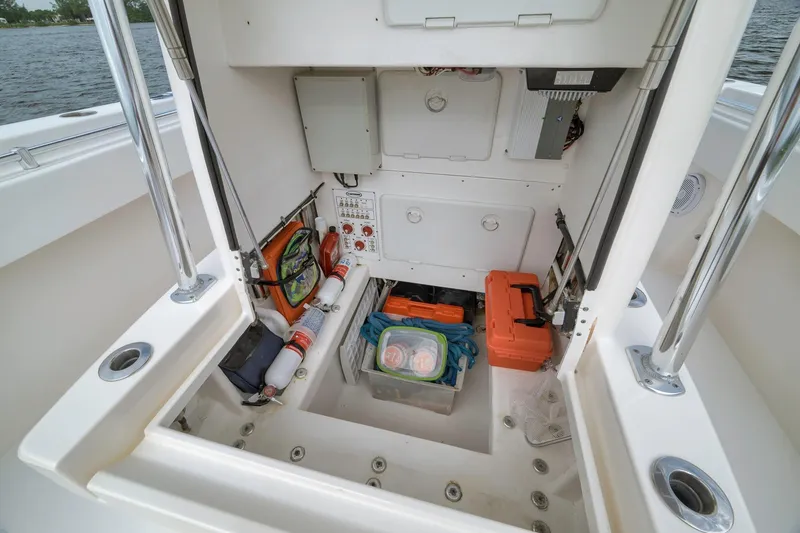 Slide: The Image of 2012 Contender 32 Tournament boat storage area with safety equipment and tools. - 45