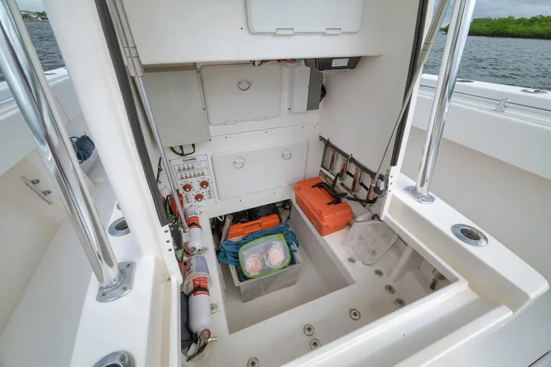 Slide: The Image of 2012 Contender 32 Tournament boat storage area with equipment and safety gear. - 46