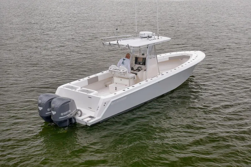 Slide: The Image of 2012 Contender 32 Tournament boat with dual Yamaha engines on open water. - 5