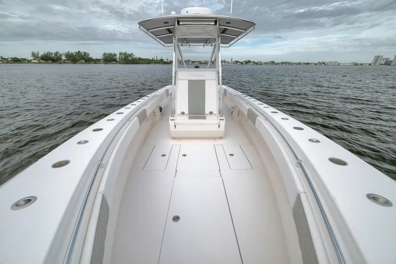 Slide: The Image of 2012 Contender 32 Tournament boat on calm water under cloudy sky. - 50