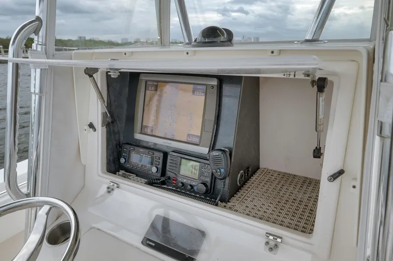 Slide: The Image of 2012 Contender 32 Tournament boat dashboard with navigation and communication equipment. - 55
