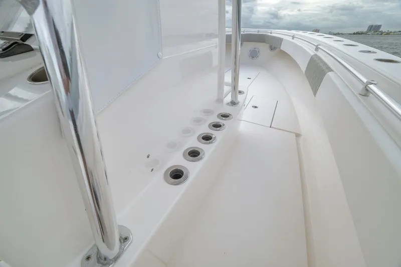 Slide: The Image of 2012 Contender 32 Tournament boat deck with rod holders and stainless steel railing. - 56