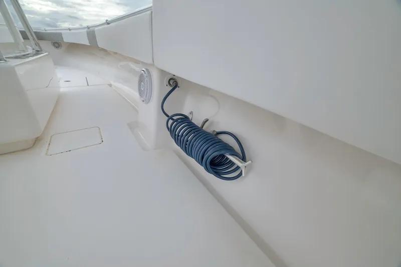 Slide: The Image of Coiled hose on 2012 Contender 32 Tournament boat deck, showcasing clean design. - 58