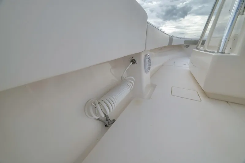 Slide: The Image of 2012 Contender 32 Tournament boat deck with coiled hose and speaker. - 59