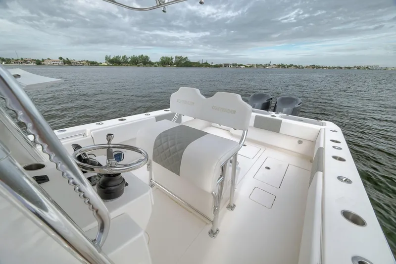 Slide: The Image of 2012 Contender 32 Tournament boat with dual engines on calm water. - 60