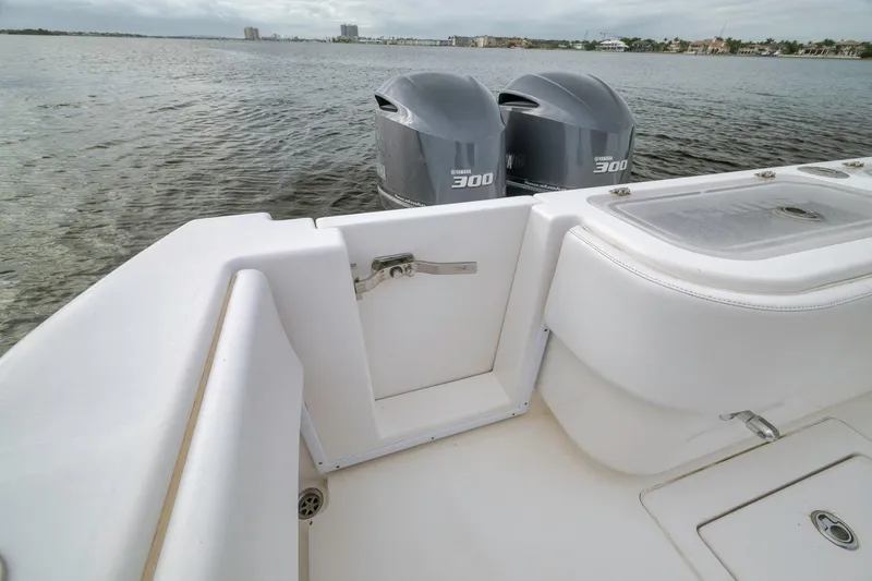 Slide: The Image of 2012 Contender 32 Tournament boat with twin Yamaha 300 engines on calm water. - 70