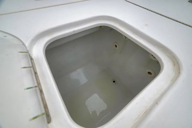 Slide: The Image of Livewell compartment on a 2012 Contender 32 Tournament boat, showcasing interior details. - 76