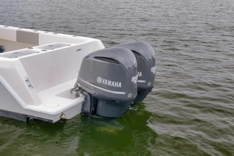 Slide: The Image of 2012 Contender 32 Tournament boat with twin Yamaha outboard motors on water. - 8