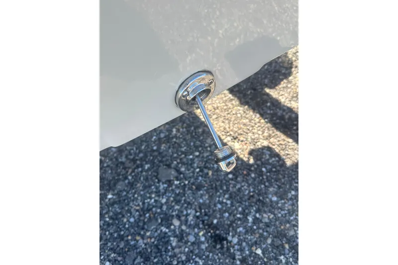 Slide: The Image of 2026 Delta Boatworks Delta D18 on trailer in a boatyard under clear blue sky. - 13