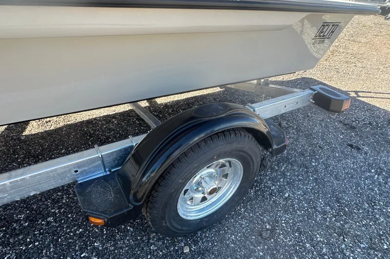 Slide: The Image of 2026 Delta Boatworks Delta D18 on trailer, parked outdoors under clear blue sky. - 16