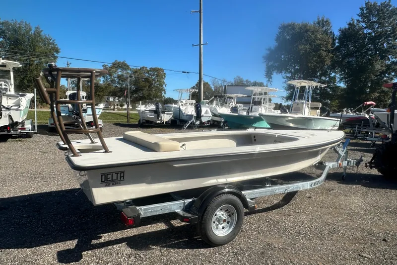 Slide: The Image of 2026 Delta Boatworks Delta D18 with Yamaha outboard motor, parked outdoors. - 3