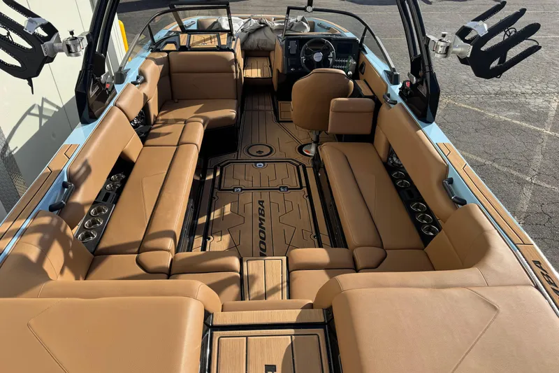 Slide: The Image of 2024 Moomba Tykon boat interior with tan seating and sleek design. - 10