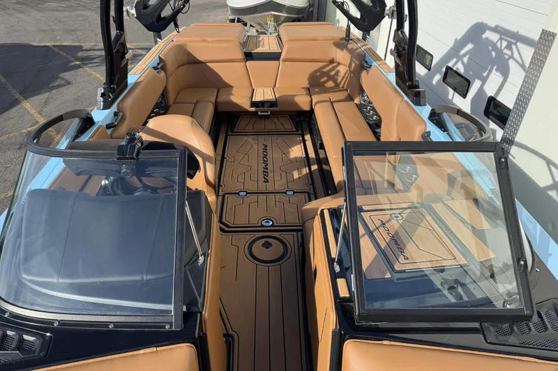 Slide: The Image of 2024 Moomba Tykon boat interior with tan seating and sleek design. - 5